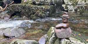 Base drives within us all stones stack by river